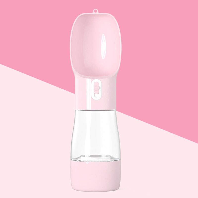 Clear pet water bottle with pink base and food storage cap for treats 