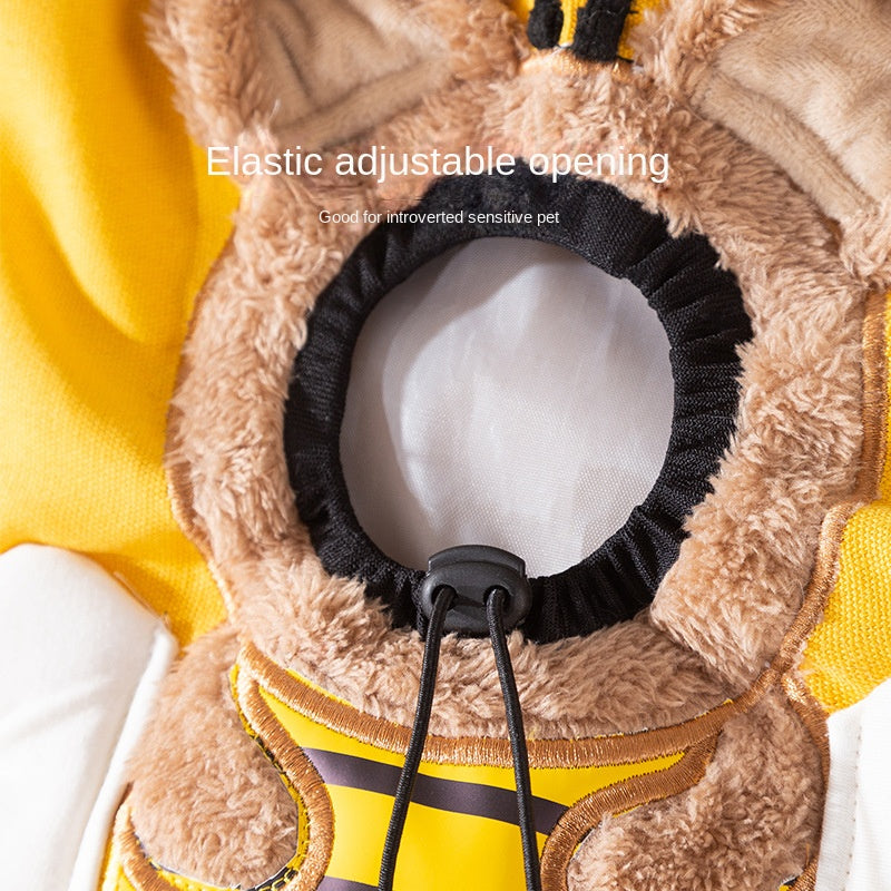 Close-up of a pet coat with an elastic adjustable opening on a yellow background