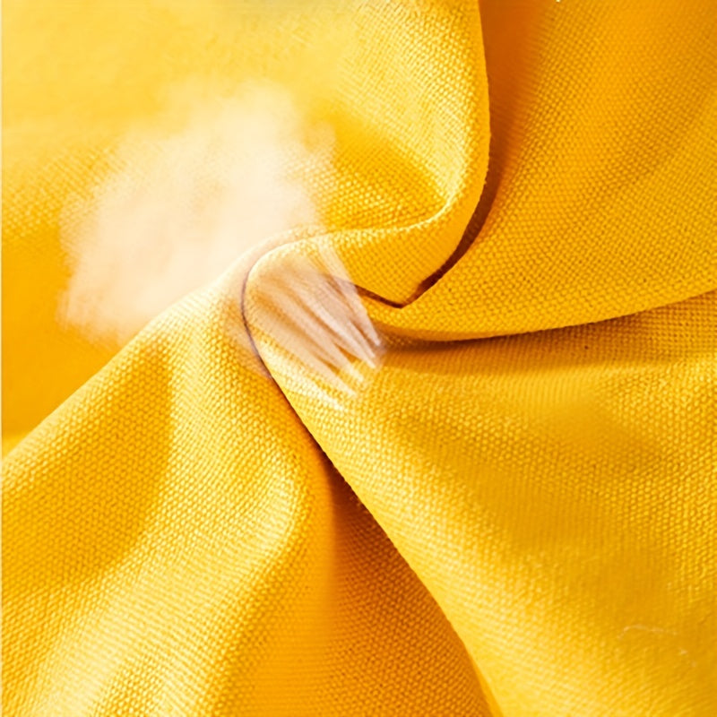 Close-up of yellow fabric with a focus on texture and color.