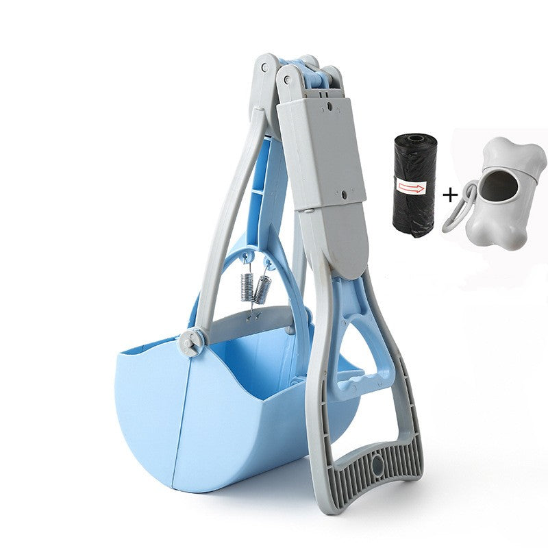 Pet waste management system with blue litter pan, gray scoop, black bag, and white container on a white background.